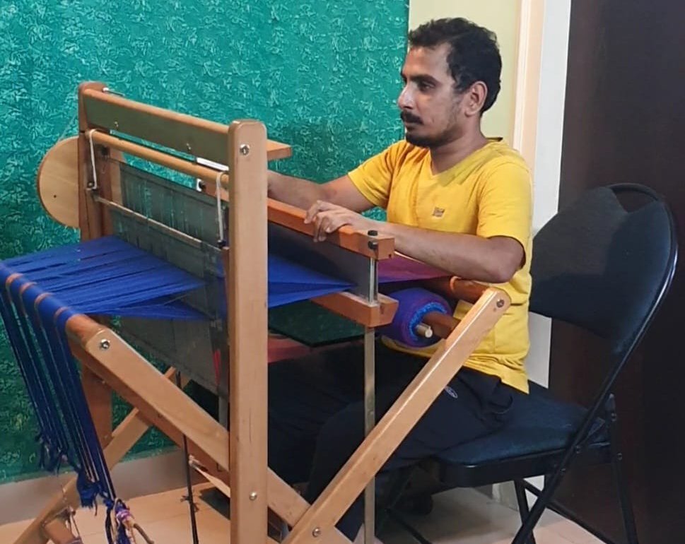 Suraj weaving at the loom